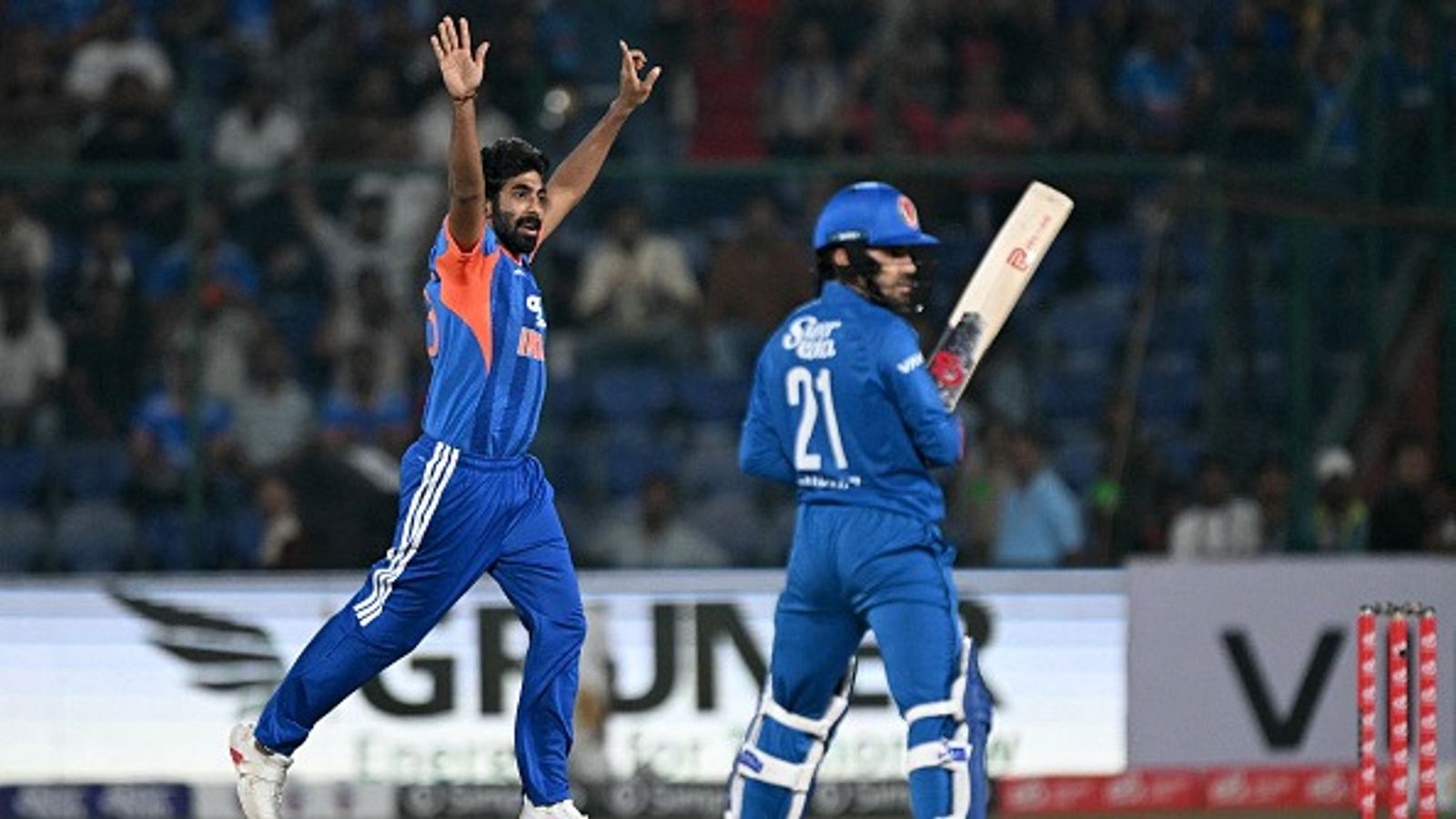 IND vs PAK: Jasprit Bumrah bags historic milestone during India vs Afghanistan first T20I India's Jasprit Bumrah (L) celebrates after taking the wicket of Afghanistan's Rahmanullah Gurbaz in this frame. (Getty)