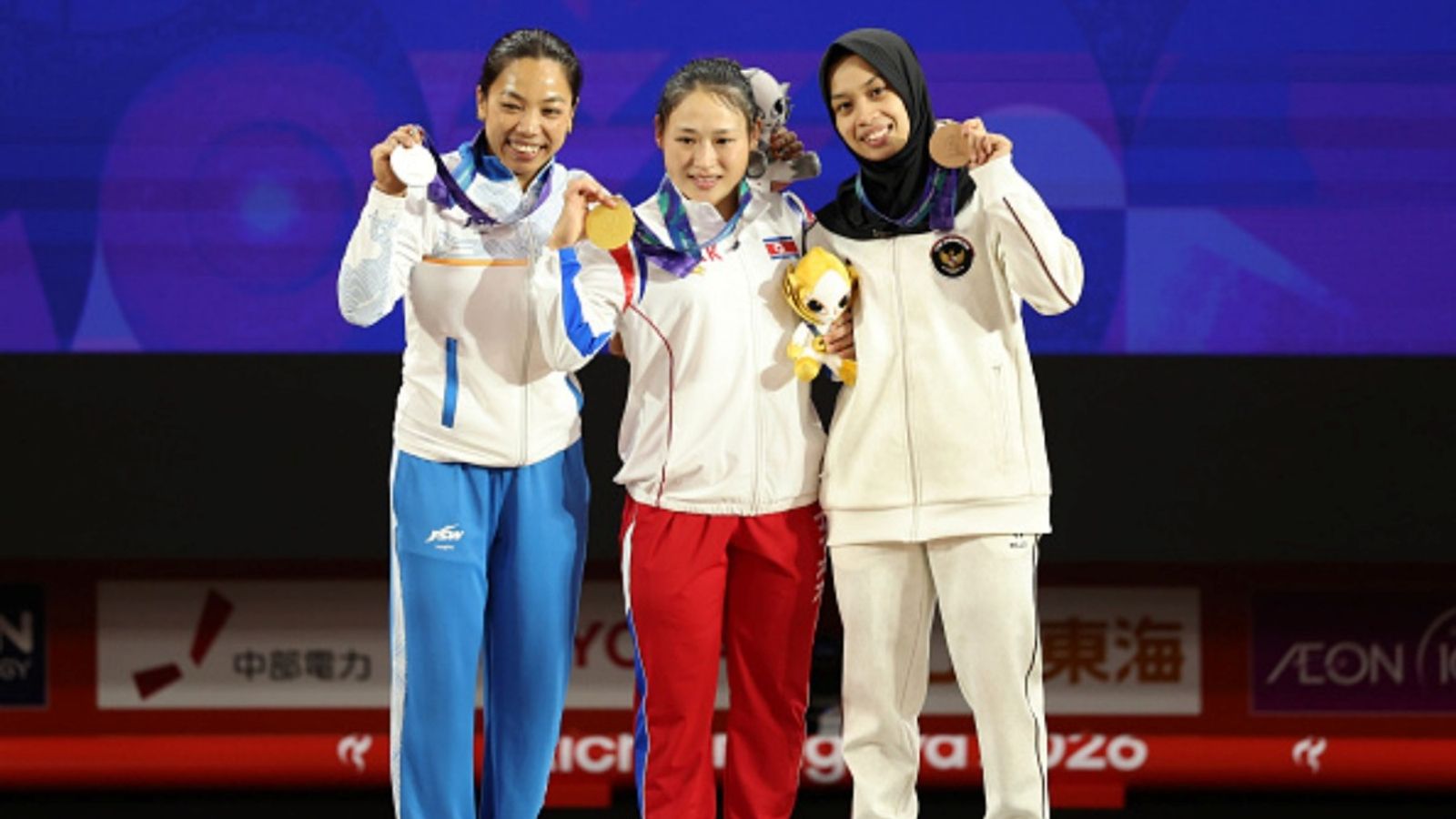 Mirabai Chanu wins her career's first Asian Games medal, India's 1st in weightlifting after 28 years Gold medalist Song Gum Ri (C) of North Korea, silver medalist Mirabai Chanu Saikhom (L) of India and bronze medalist Luluk Diana Tri Wijayana (R) of Indonesia pose on the podium at the 20th Asian Games Aichi-Nagoya.