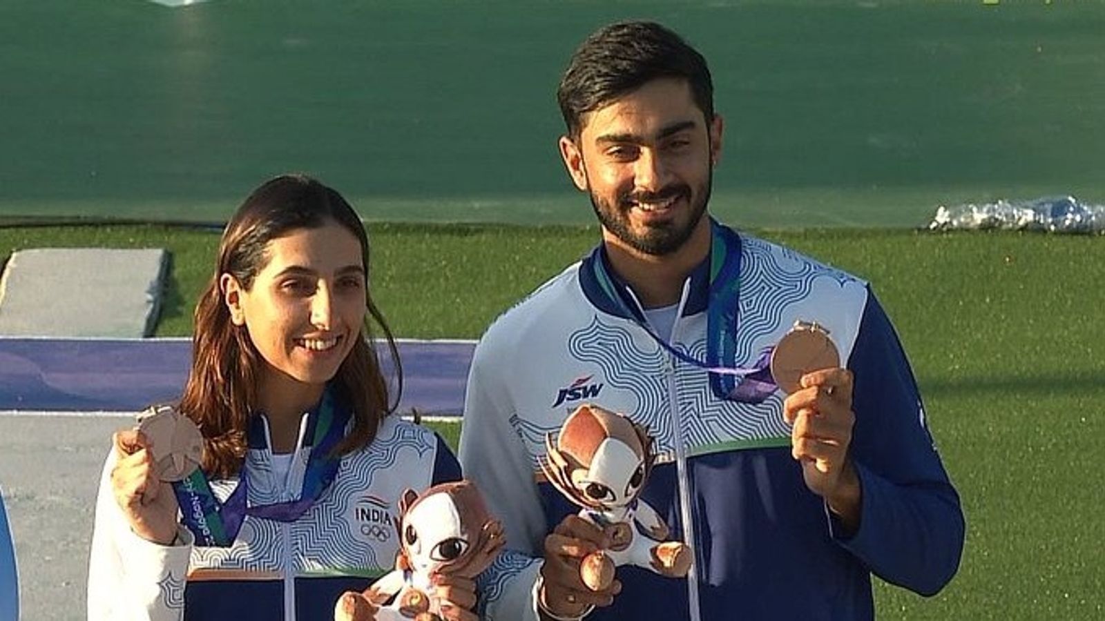 Anantjeet, Parinaaz bag bronze in skeet mixed team despite levelling scores with Korea, here's why! Indian shooters Parinaaz Dhaliwal, Anantjeet Singh pose with bronze medal after mixed team skeet event final at Asian Games 2026.