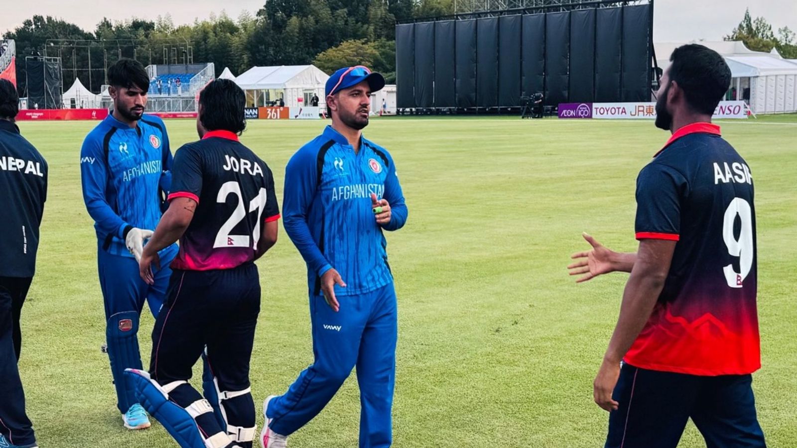 Nepal stun Afghanistan as Bhurtel-Rajbanshi combine to take 7 wickets in low-scoring Asian Games 2026 encounter Afghanistan and Nepal players during customary handshake following latter's 5-wicket win in Asian Games 2026 match.