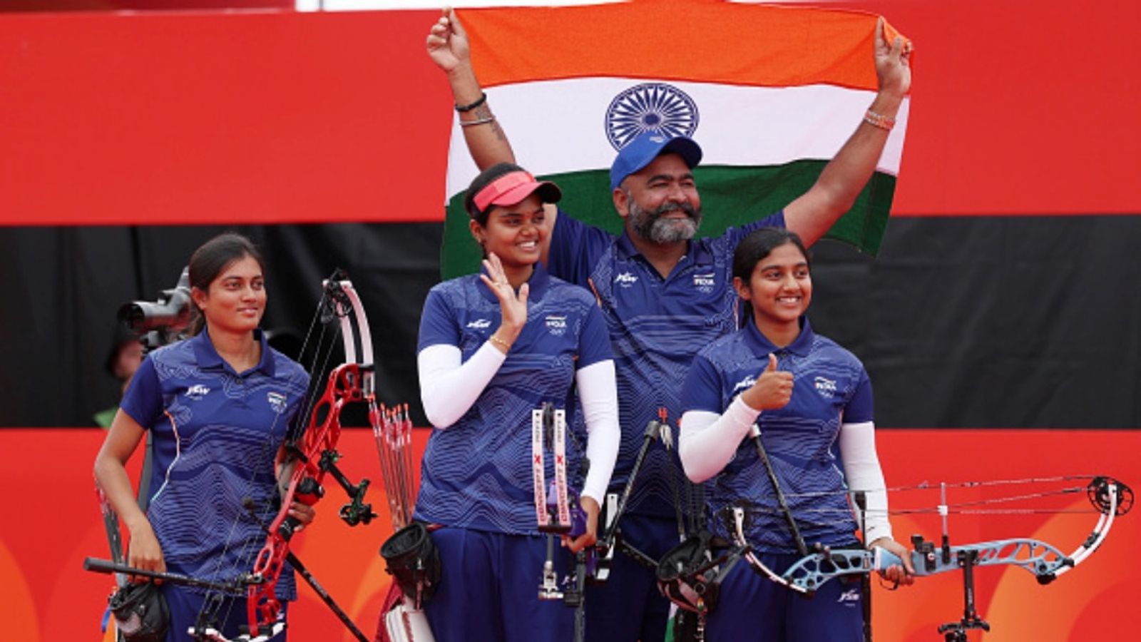 India women's archery team equal world record to beat China and win gold, take tally to 7 Chikitha Taniparthi, Prithika Pradeep and Jyothi Surekha Vennam of India celebrate winning the gold medals after competing in the Archery Compound Women's Team Gold Medal Match against China on day eleven of the 20th Asian Games Aichi-Nagoya.