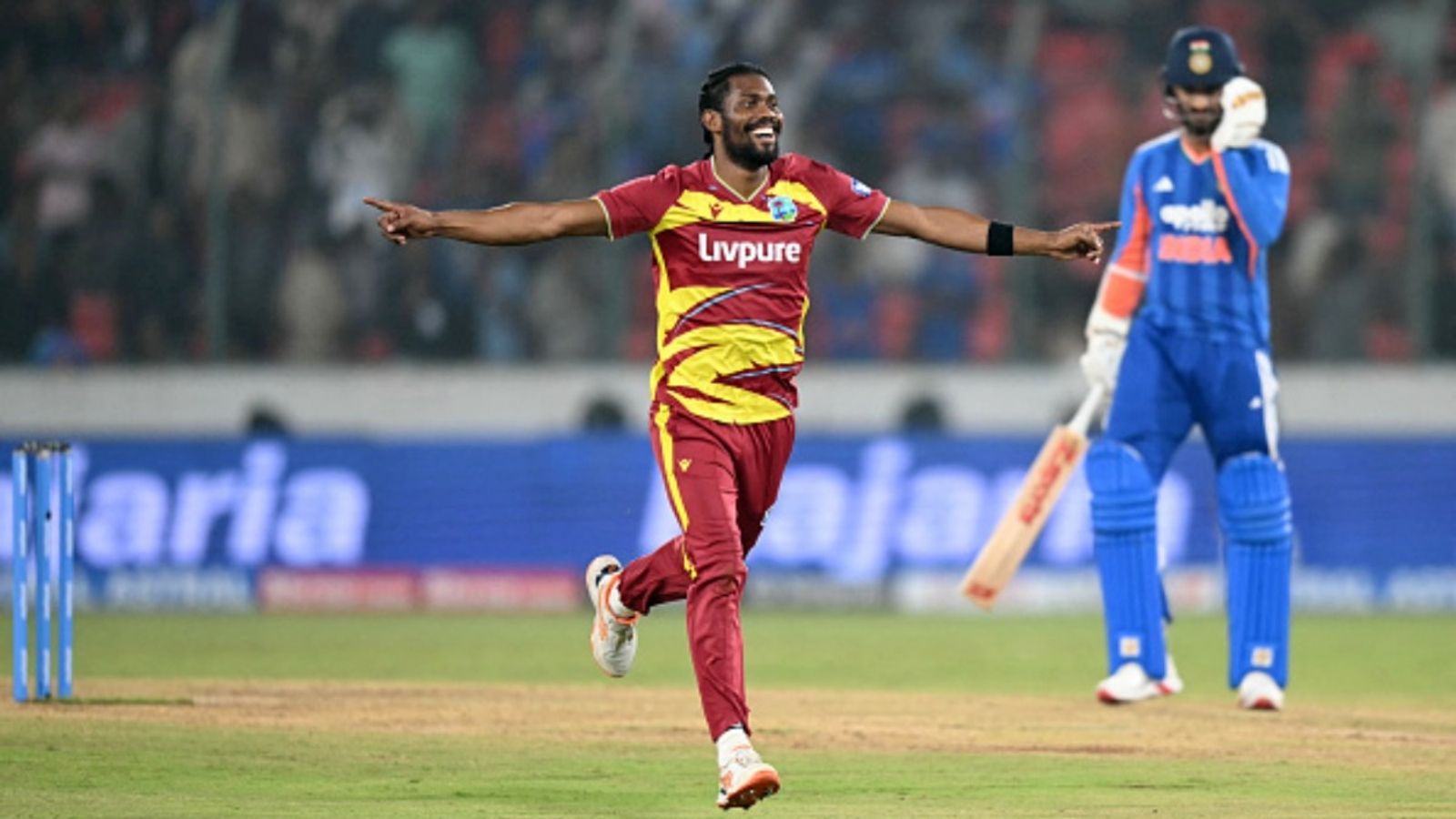 Keemo Paul becomes 1st visiting bowler to achieve this T20I feat vs India in 19 years West Indies' Keemo Paul (L) celebrates after taking the wicket of India's Axar Patel during the fourth T20I of the series at the Rajiv Gandhi International Stadium in Hyderabad on October 14, 2026.