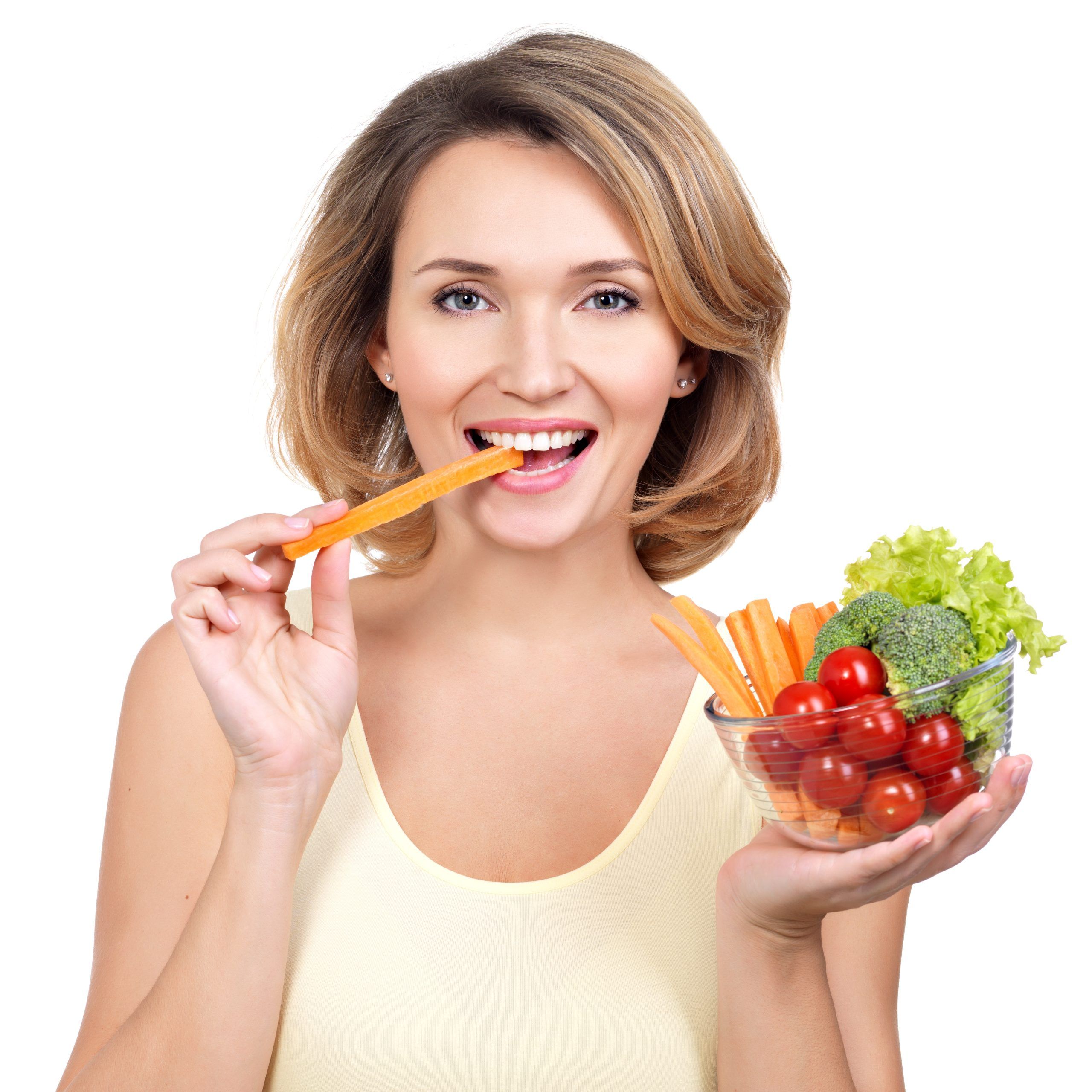 beautiful young healthy woman eating salad isolated white