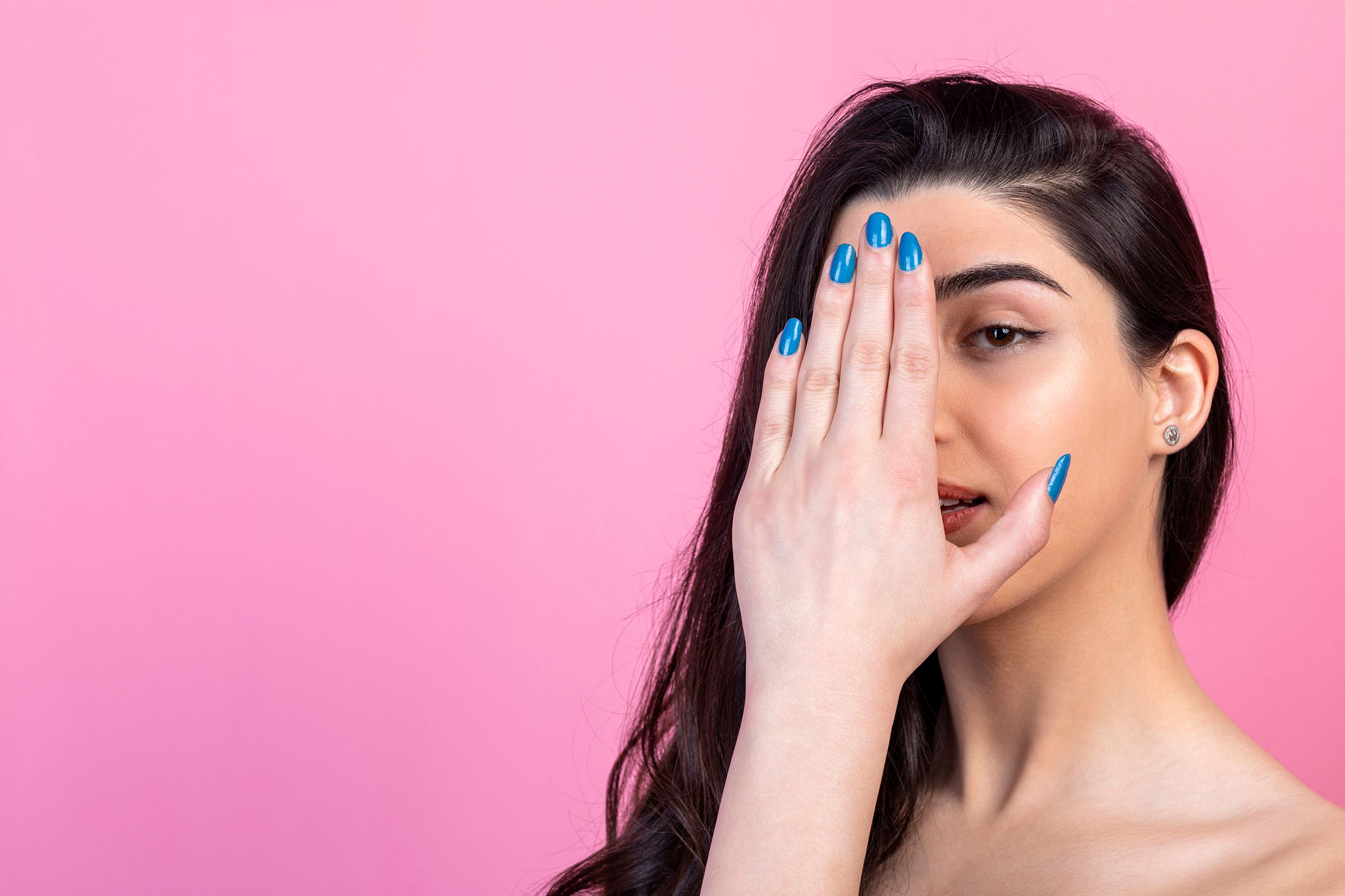 adorable girl holding her hand her eye looking camera high quality photo