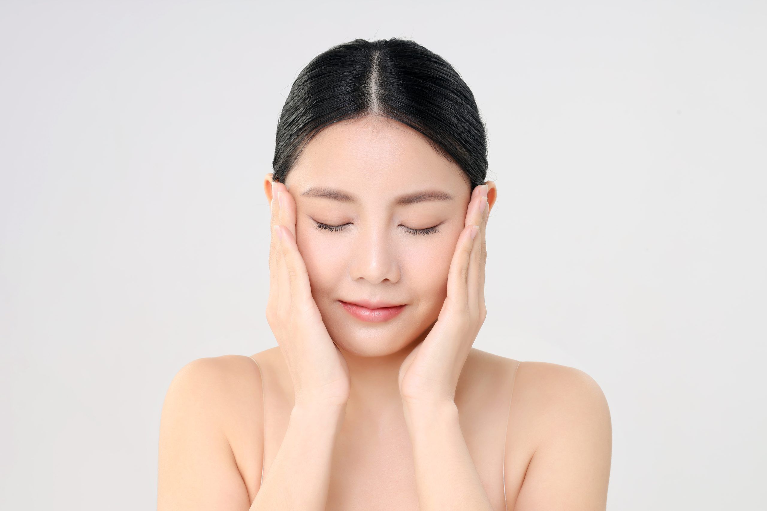 beautiful-face-young-adult-asian-woman-with-clean-fresh-skin-isolated-white
