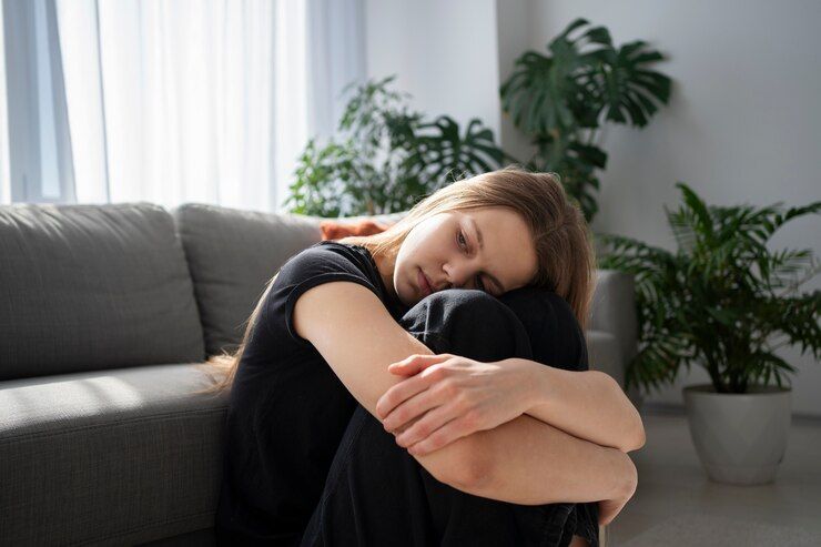 sad young woman home 23 2149404018