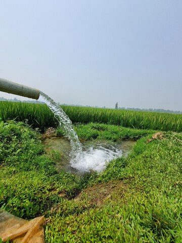water sprinkler is spraying out field 1221975 8