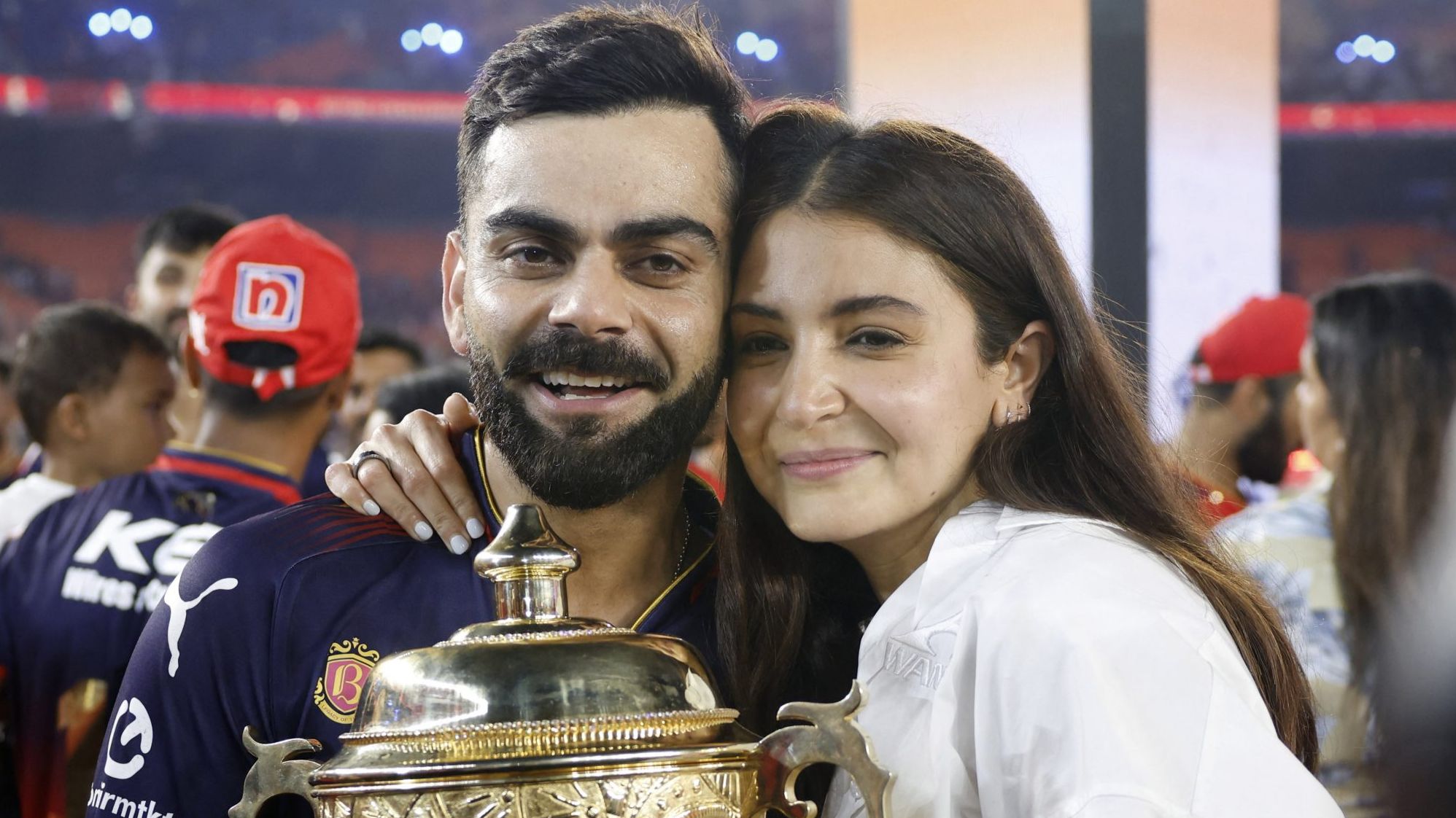 Virat Kohli, Anushka Sharma pose with IPL 2025 title
