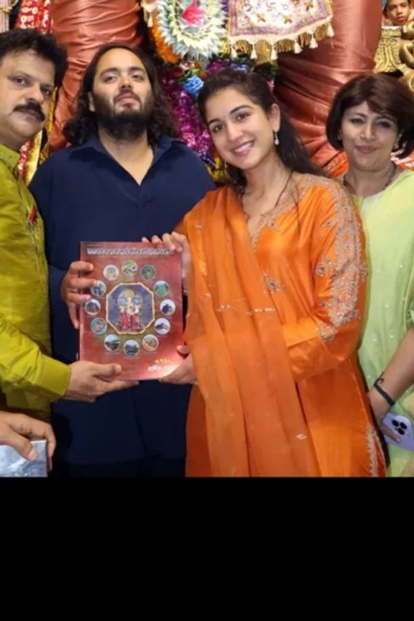 radhika merchant orange dress Bollywood Celebrity Style | Radhika and Anant Ambani at Lalbaugh Cha Raja. She's wearing @lajjooc Custom Orange Nandita Kurta and Pant (63,900) with Mayar